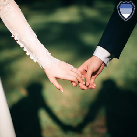 Bride and groom holding hands