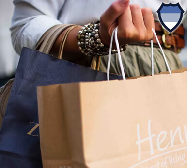 A lady holding bags of shopping