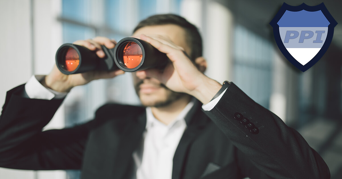 An investigator looking through a pair of binoculars